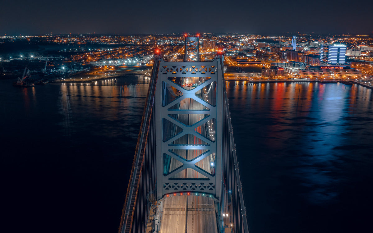 Aerial night view down the Ben Franklin Bridge toward Camden, Philadelphia