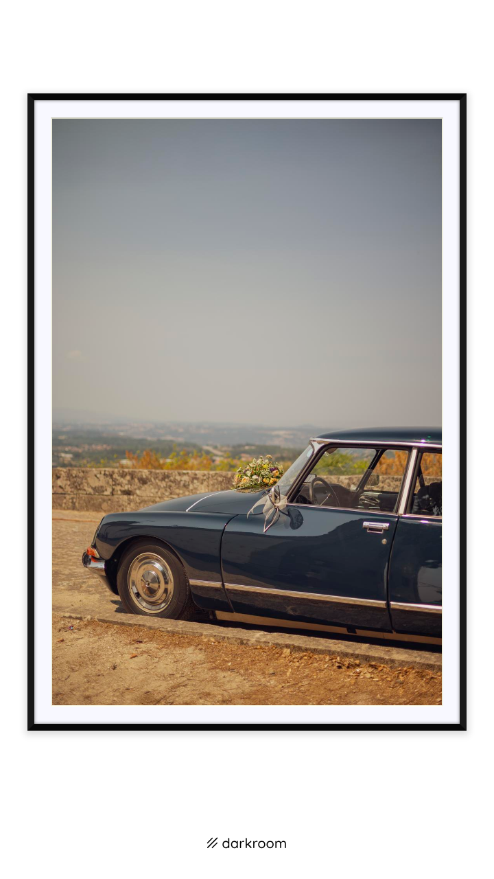 Black-framed print: A vintage sedan parked on a dusty hilltop in Portugal